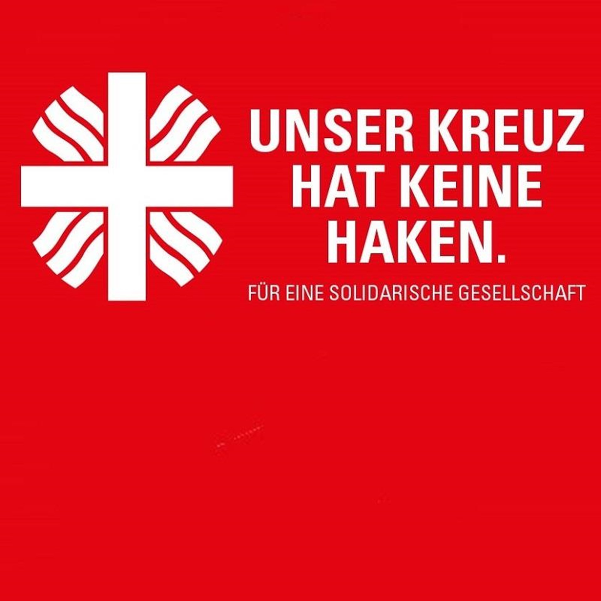 Flammkreuz mit Schriftzug: "Unser Kreuz hat keine Haken" auf rotem Grund.